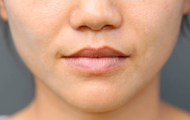 istock Asian girl mouth close up. 667697540