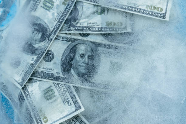 istock 100 dollars frozen melt. 667698056