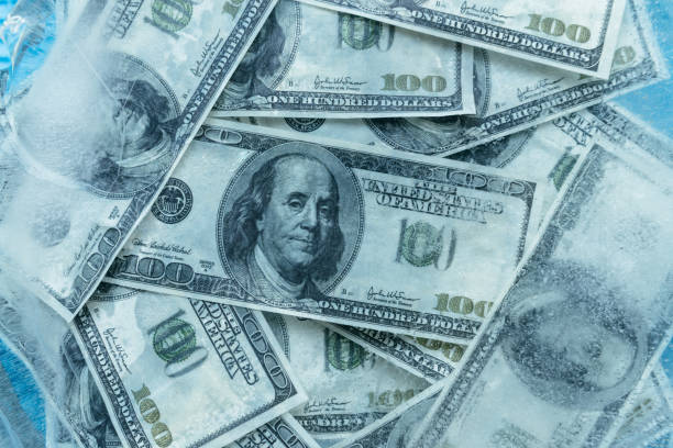 istock 100 dollars frozen melt. 667698216