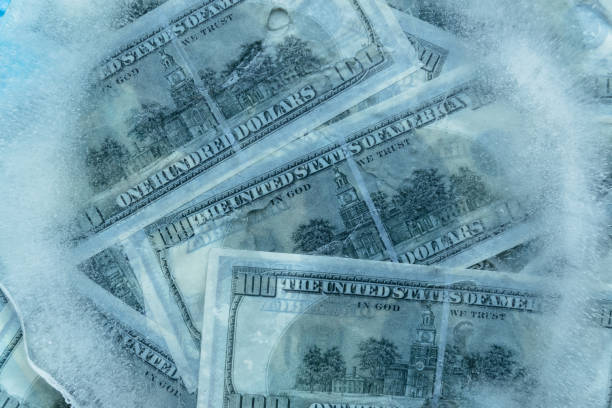 istock 100 dollars frozen melt. 667698410