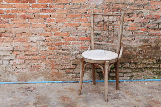 istock chair ancient  in the old brick wall. 667701988