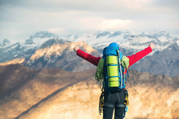 istock Traveler Man with backpack mountaineering 667704664