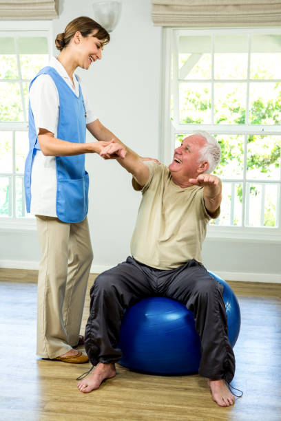 istock Happy senior man being examined by nurse 667708990
