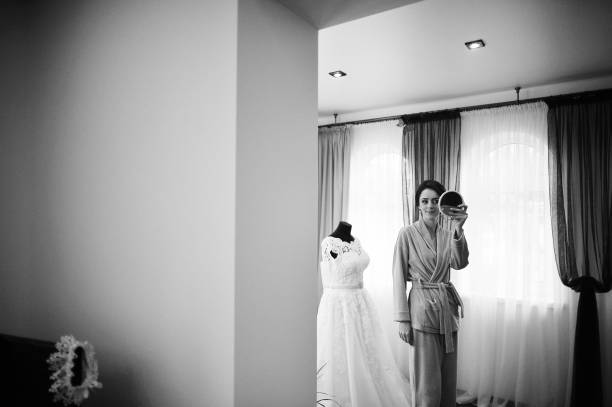 istock Young brunette bride looked at the mirror 667709172