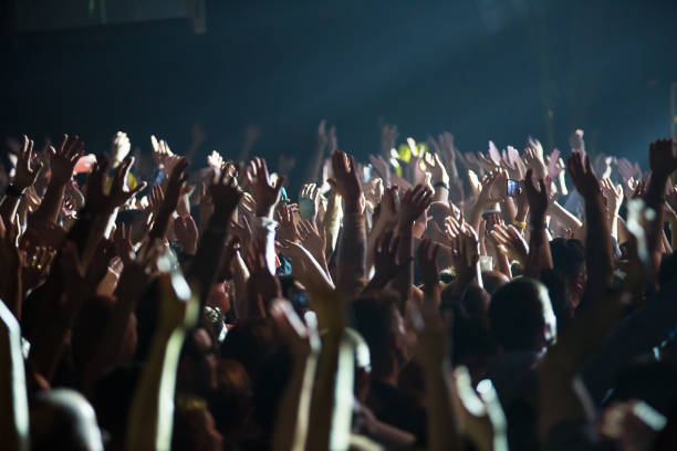 istock Crowd at concert and blurred stage lights . 667711998