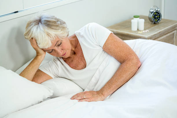 istock High angle view of senior woman sleeping 667712000