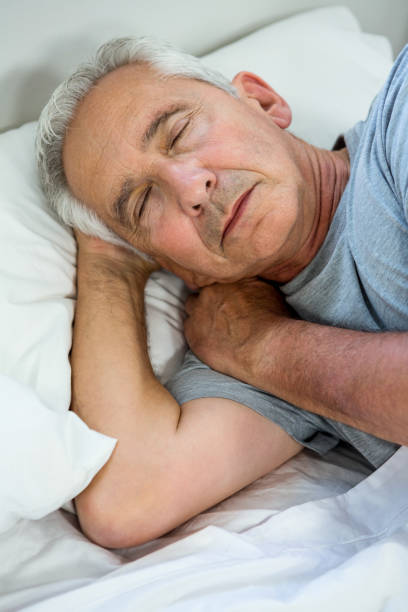 istock High angle view of senior man relaxing 667712422