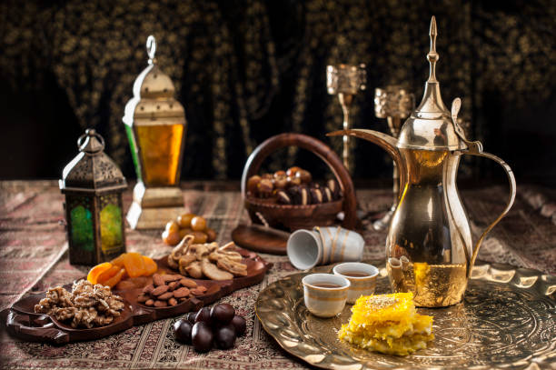 Traditional Arabian coffee, nuts and sweets Traditional Arabian coffee, nuts and sweets served to guest at majlis arabica coffee drink photos stock pictures, royalty-free photos & images
