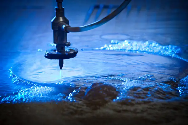 Water-jet Machine at work cutting a steel plate. Detail.