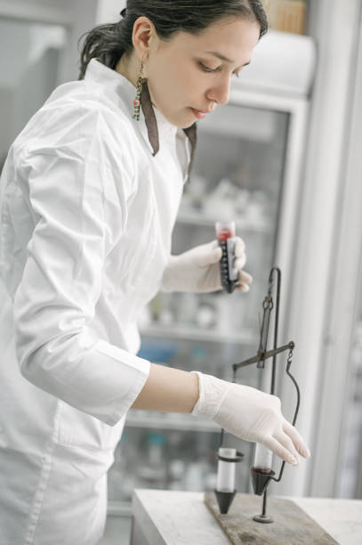 istock Medical laboratory scientists holding a test tube with sample 667722166