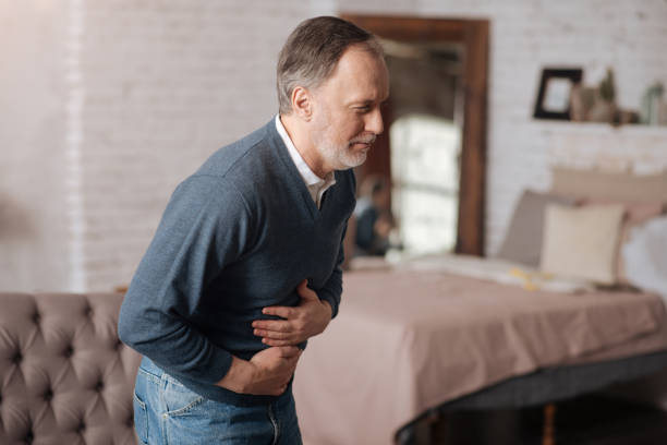 istock Old man with strong stomach-ache 667722208
