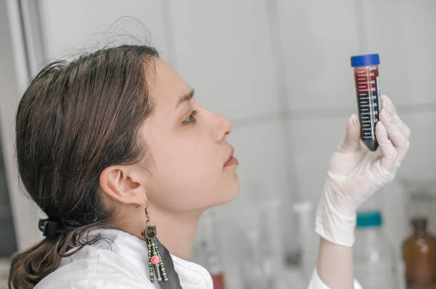 istock Medical laboratory scientists holding a test tube with sample 667723216