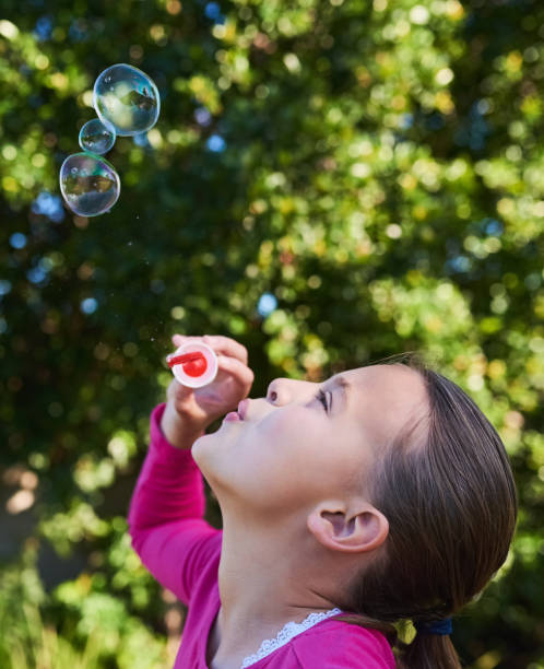 istock Nothing says childhood like blowing bubbles 667723502
