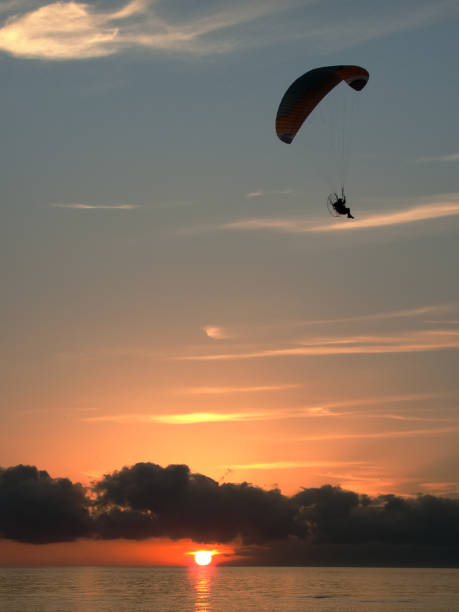 istock paragliding on the sea 667726574