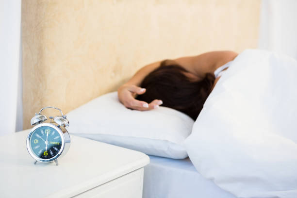 istock Sleepy woman in her bed 667734460