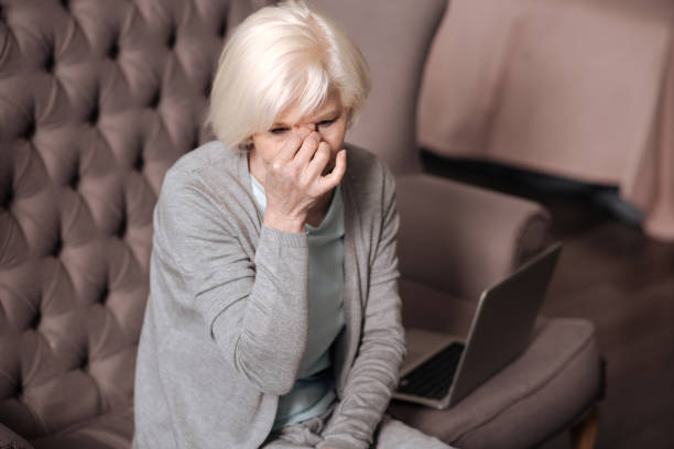 istock Top view of senior woman with headache 667734680