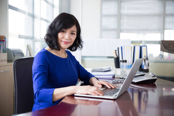istock middle-aged female manager working in office 667738684