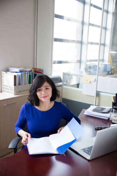 istock middle-aged female manager working in office 667738992