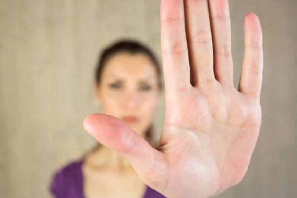 istock Woman showing stop sign 667739126