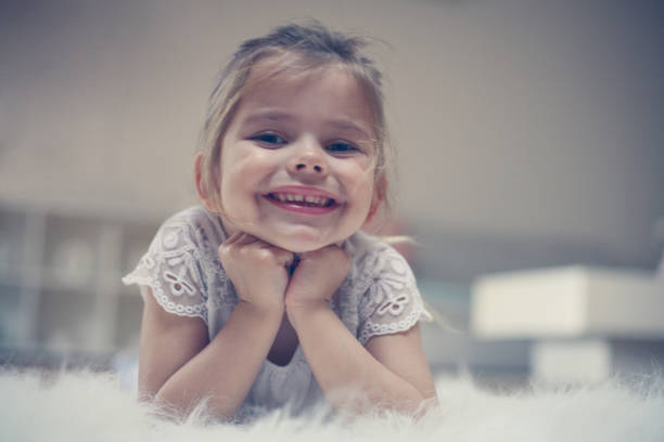 istock Little girl lying on floor. 667743874