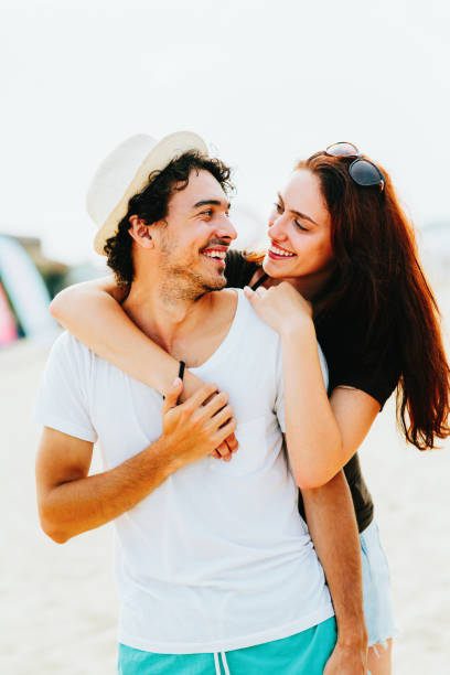 istock Young couple at the beach 667743892