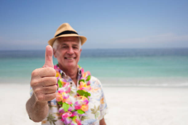 istock Happy senior man showing is thumbs up 667745280
