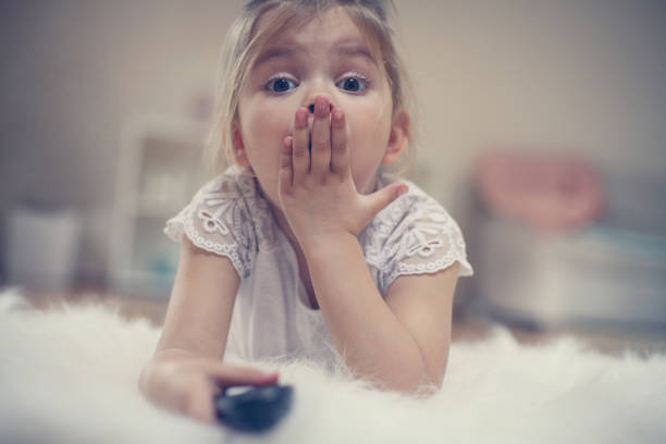 istock Cute little girl lying on floor. 667746590