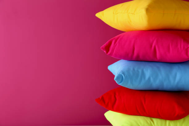 istock Colorful pillows on a pink background 667747898