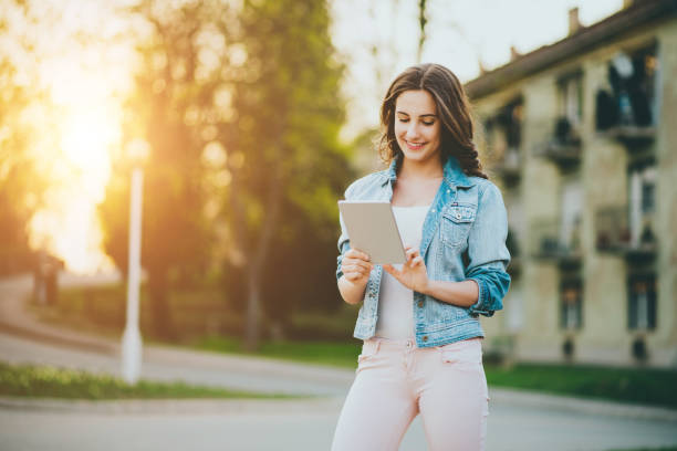 istock teenager girl using tablet 667753458