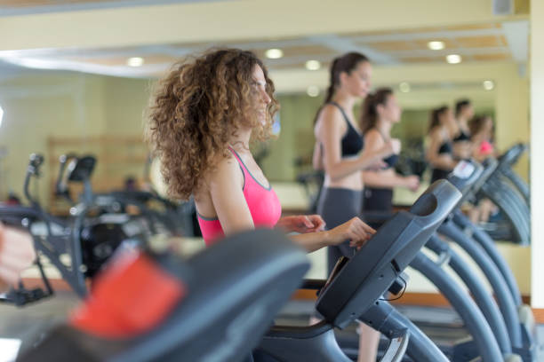 istock Women jogging on treadmill 667755854