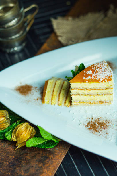 istock Fresh passion fruit cake with coconut and cinnamon. Dessert on plate. The restaurant or cafe atmosphere 667758716