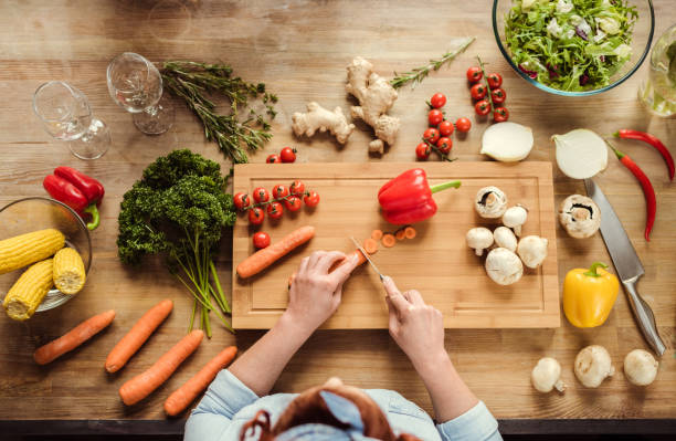 istock Woman preparing salad 667758974