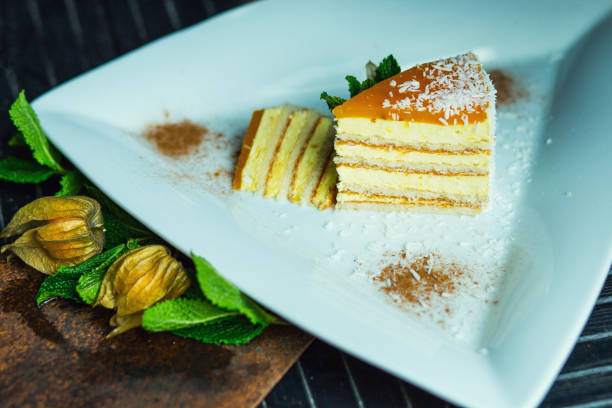 istock Fresh passion fruit cake with coconut and cinnamon. Dessert on plate. The restaurant or cafe atmosphere 667759006