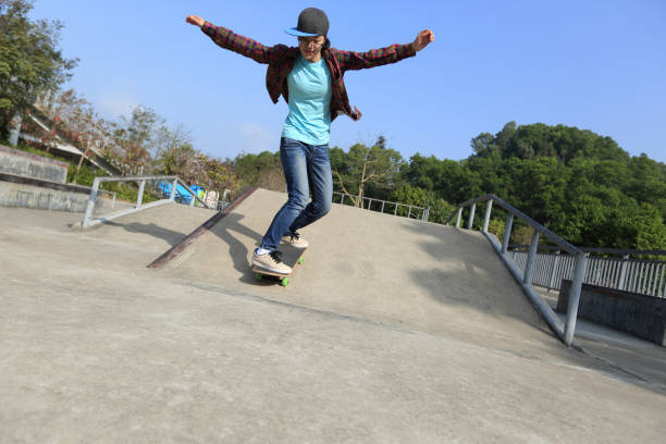 istock young skateboarder riding skateboard at skatepark 667759138