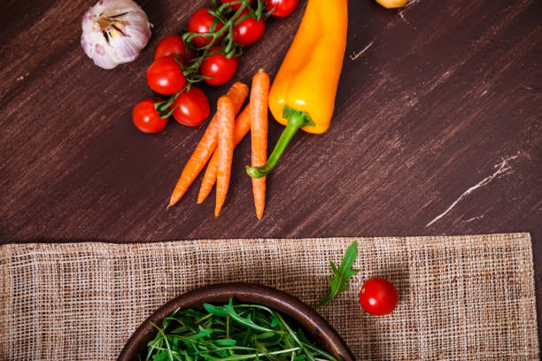 istock Green arugula leaves in bowl. Fresh salad. 667760478