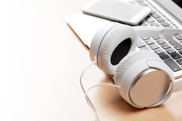 istock Headphones over laptop 667763716