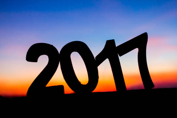 istock Blurred concept New Year holiday Silhouette sunset for background. 667763812