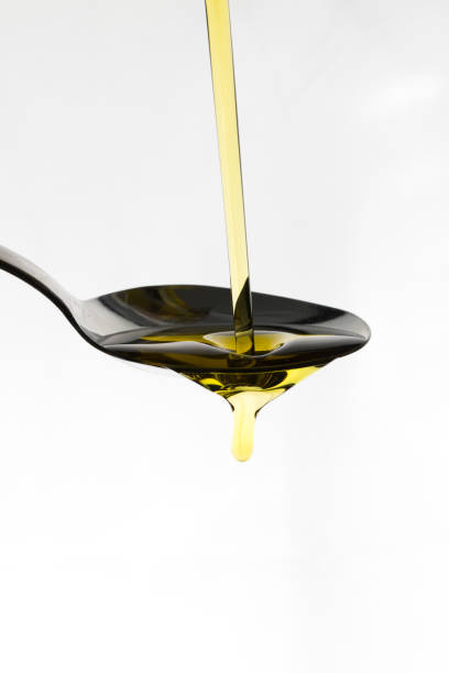 istock Oil being poured onto a spoon 667764200
