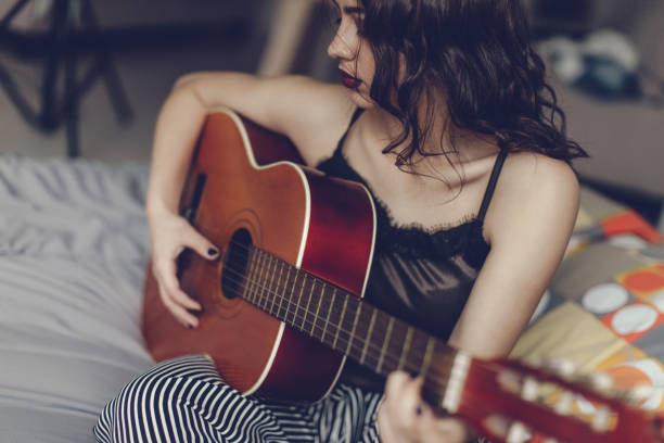 istock Woman with guitar 667766832