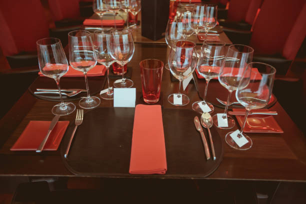 istock wine glass setup on the dinner table in luxury dinner party, Blurry background with vintage color style. 667767512