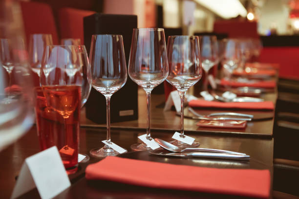 istock wine glass setup on the dinner table in luxury dinner party, Blurry background with vintage color style. 667767694