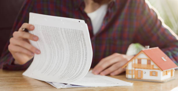 istock Hipster businessman applying for a mortgage 667768072