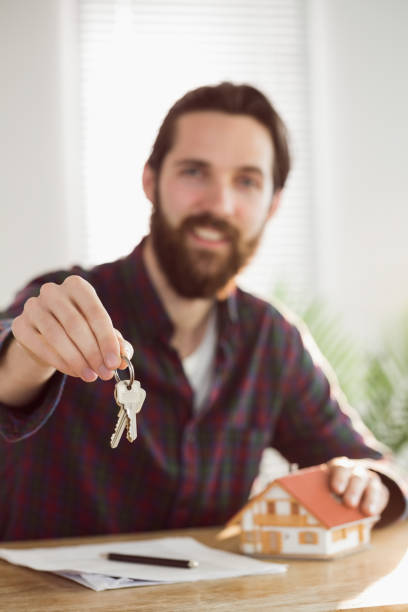istock Hipster businessman applying for a mortgage 667768104