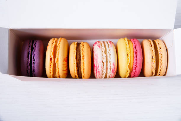 istock Macaroon cakes. Dessert in delivery box. 667774944