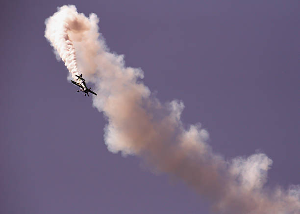 istock Low Angle View Of Airplane Performing Airshow 667776357