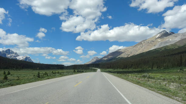 istock Panorama on highway in Canada with mountains and farsightedness 667777376