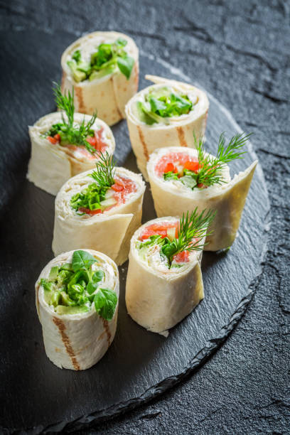 istock Fresh rolls with vegetables, cheese and herbs for a brunch 667777572