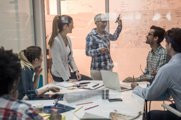 istock Team of creative people having a constructive meeting in the office. 667778526