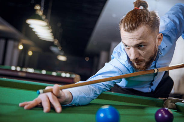istock Young man is preparing to hit the ball 667791254