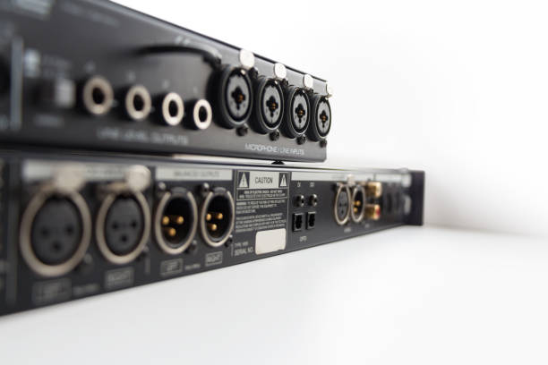 Professional sound equipment with input and output connectors. Selective focus Professional sound equipment with input, output connectors. Back side. Selective focus, shallow depth of field input output pictures stock pictures, royalty-free photos & images